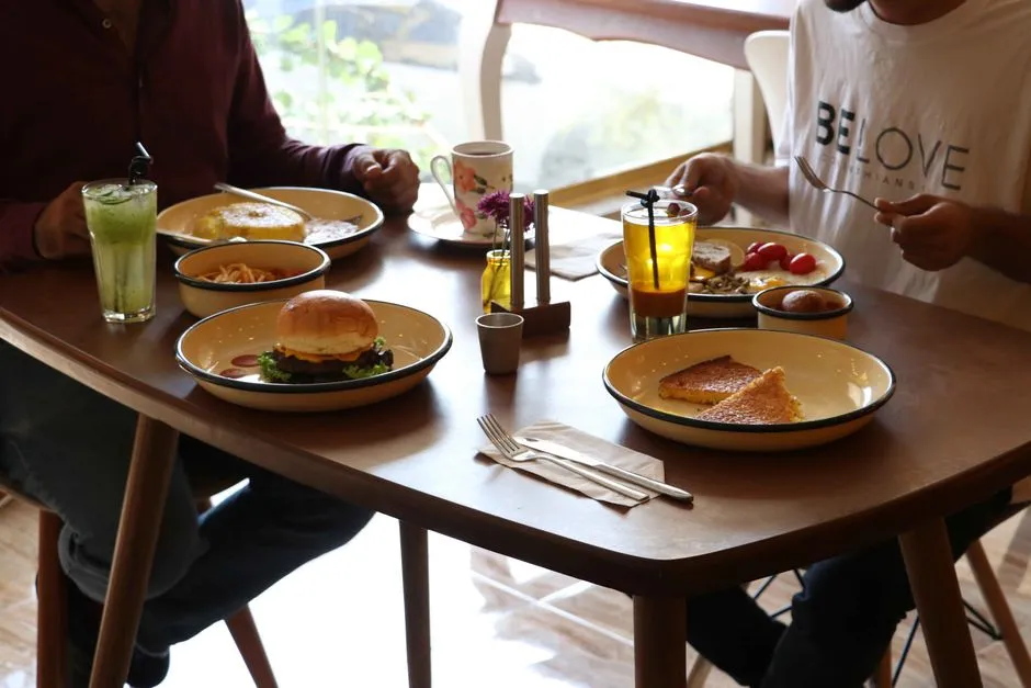 Friends sharing a casual brunch meal at a restaurant table